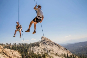 Father-son rappelling in Sierras